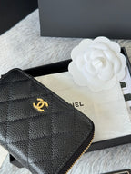 Small leather bag corner, black quilted texture with gold Chanel emblem