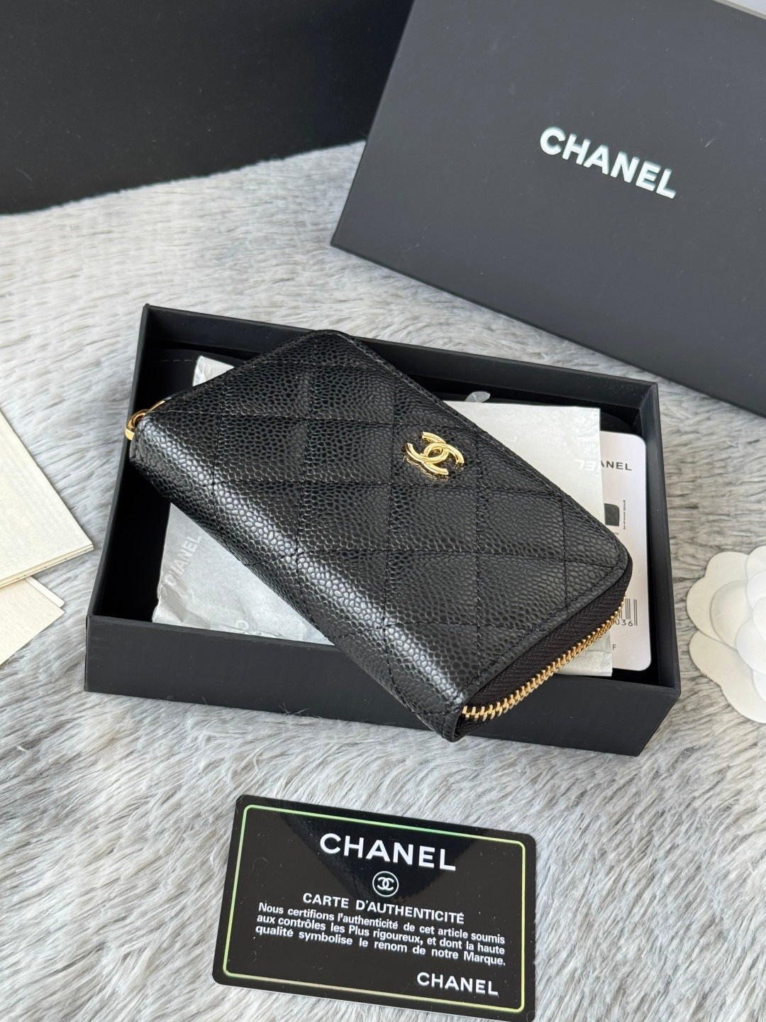 Small leather bag, black textured quilt with gold Chanel logo and zip edge