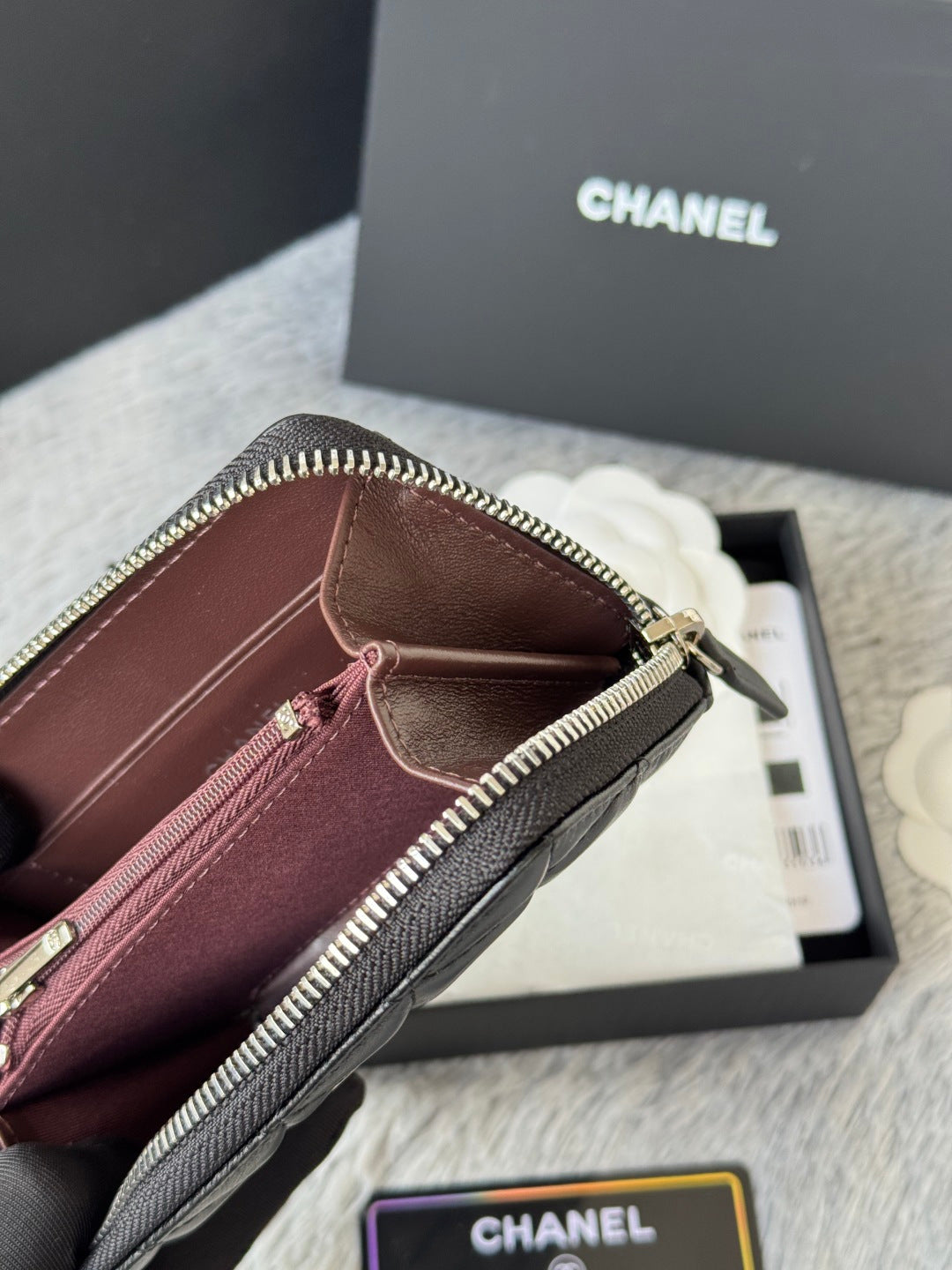 Small bag: burgundy-lined zip wallet pouch interior, gold zipper and clasp