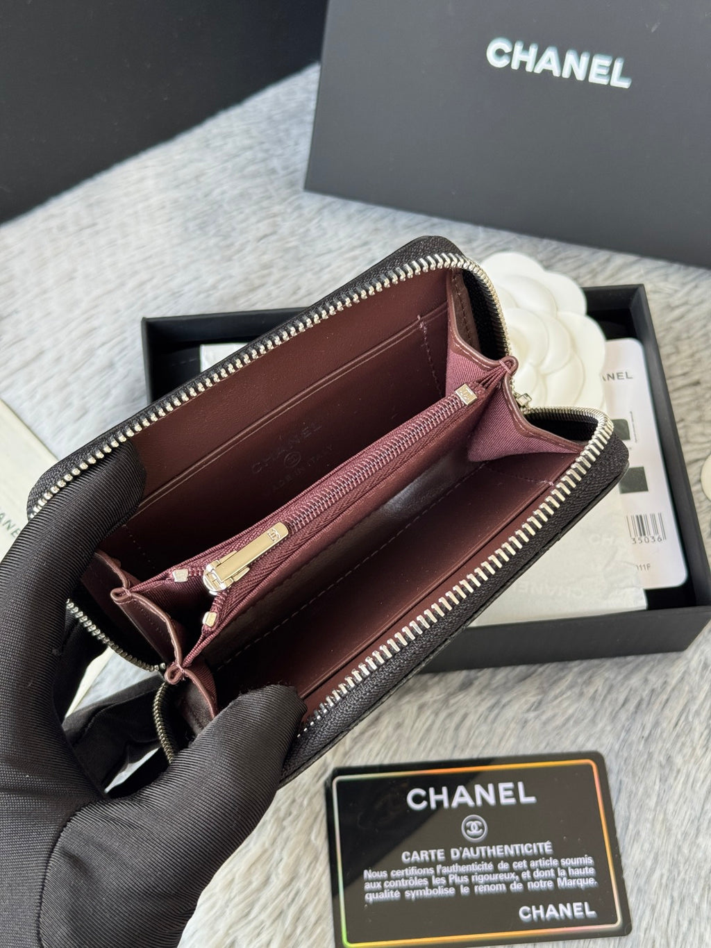 Small bag: open zip wallet pouch with burgundy lining and gold-tone hardware