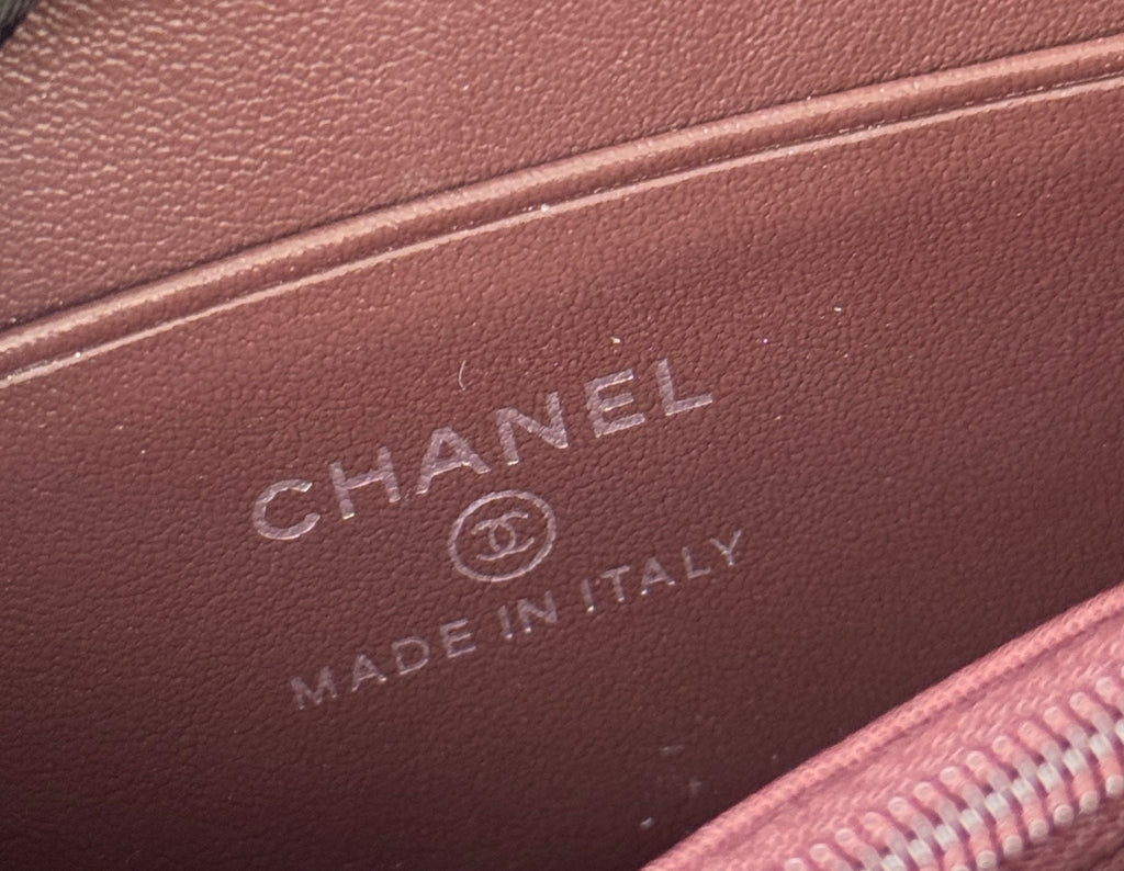 Small bag interior label with CHANEL and MADE IN ITALY on dark leather