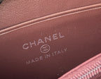 Small bag interior label with CHANEL and MADE IN ITALY on dark leather