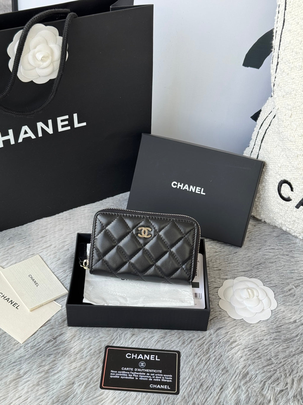 Small bag: black quilted zip pouch with CHANEL logo and chain strap