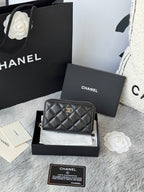 Small bag: black quilted zip pouch with CHANEL logo and chain strap