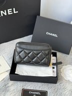 Small quilted zip wallet, dark leather with gold-tone zipper and logo