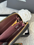 Small zip wallet interior, burgundy lining with card slot and gold zipper