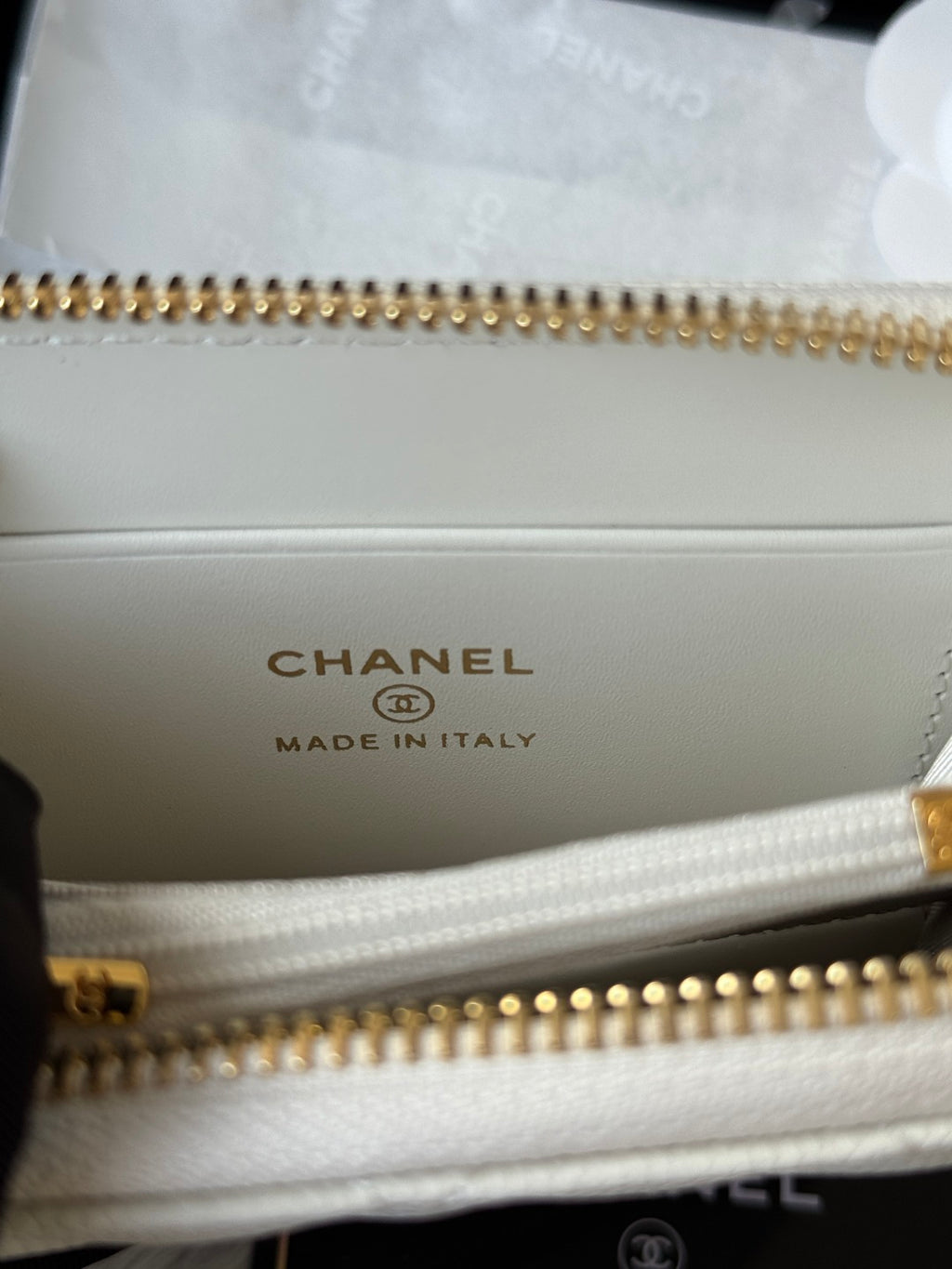 Small bag interior with CHANEL logo, gold-tone zipper, and Made in Italy mark