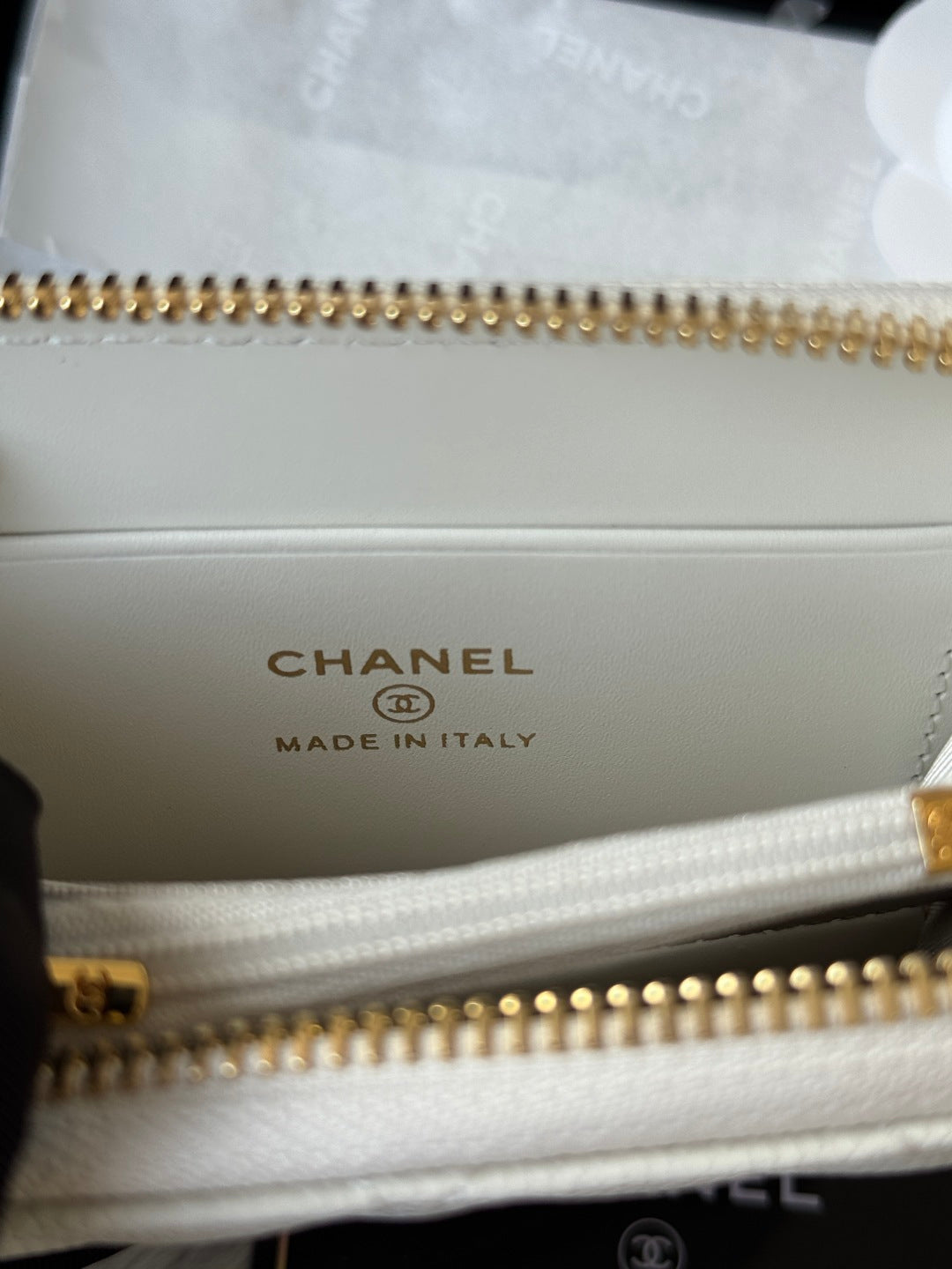 Small bag interior with CHANEL logo, gold-tone zipper, and Made in Italy mark