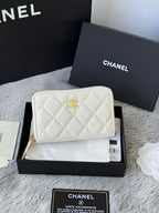 White quilted small bag with front CC emblem and gold zip top