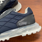 Givenchy navy leather sneaker with quilted panel, black toe cap, and clear sole