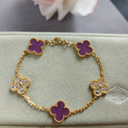 Gold-tone clover enamel bracelet with purple quatrefoil charms and sparkling accents