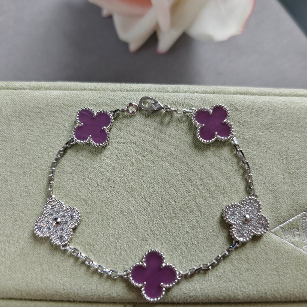 Clover enamel bracelet with silver-tone links and purple quatrefoil charms