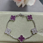 Clover enamel bracelet with silver-tone links and purple quatrefoil charms