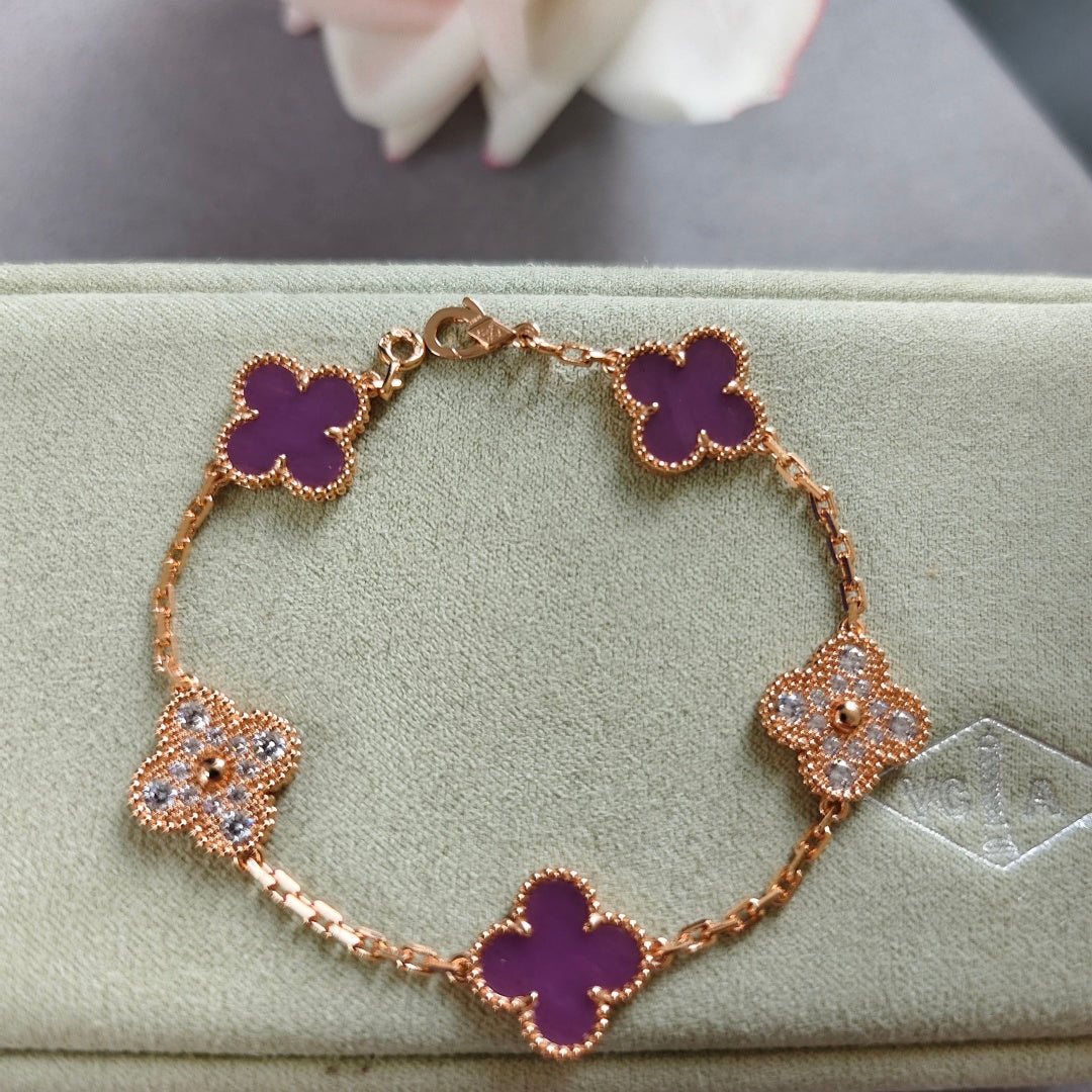 Clover enamel bracelet with gold-tone links and purple quatrefoil charms