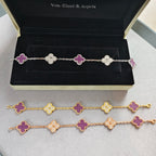 Clover enamel charm bracelets in gold-tone and silver-tone, with purple quatrefoil flowers