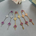 Set of clover charm bracelets with purple enamel, in silver, gold, and rose gold tones