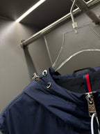 Navy hooded vest neckline with drawcord and zipper hardware