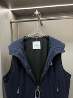 Navy hooded padded vest, front view with dark interior lining