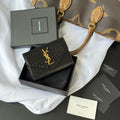 Small bag with front flap, black croc-embossed texture and gold YSL logo on cover