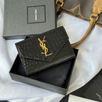 Small bag with flap and black croc-embossed pattern, gold YSL logo at center
