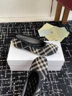 Check-print slip-on flat with black quilted toe detail and blue logo embroidery
