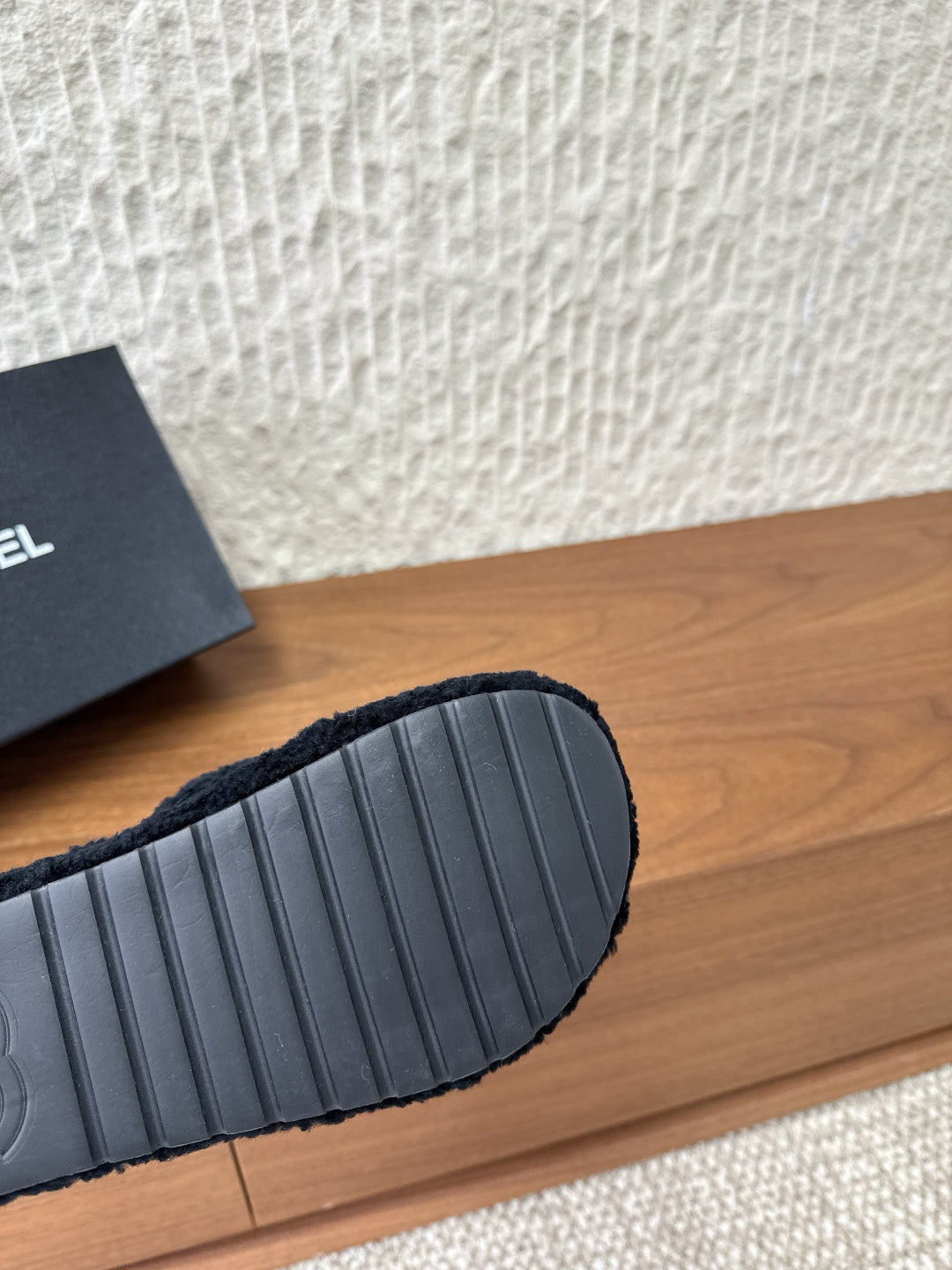 Black slide sandal rubber outsole with textured ridges