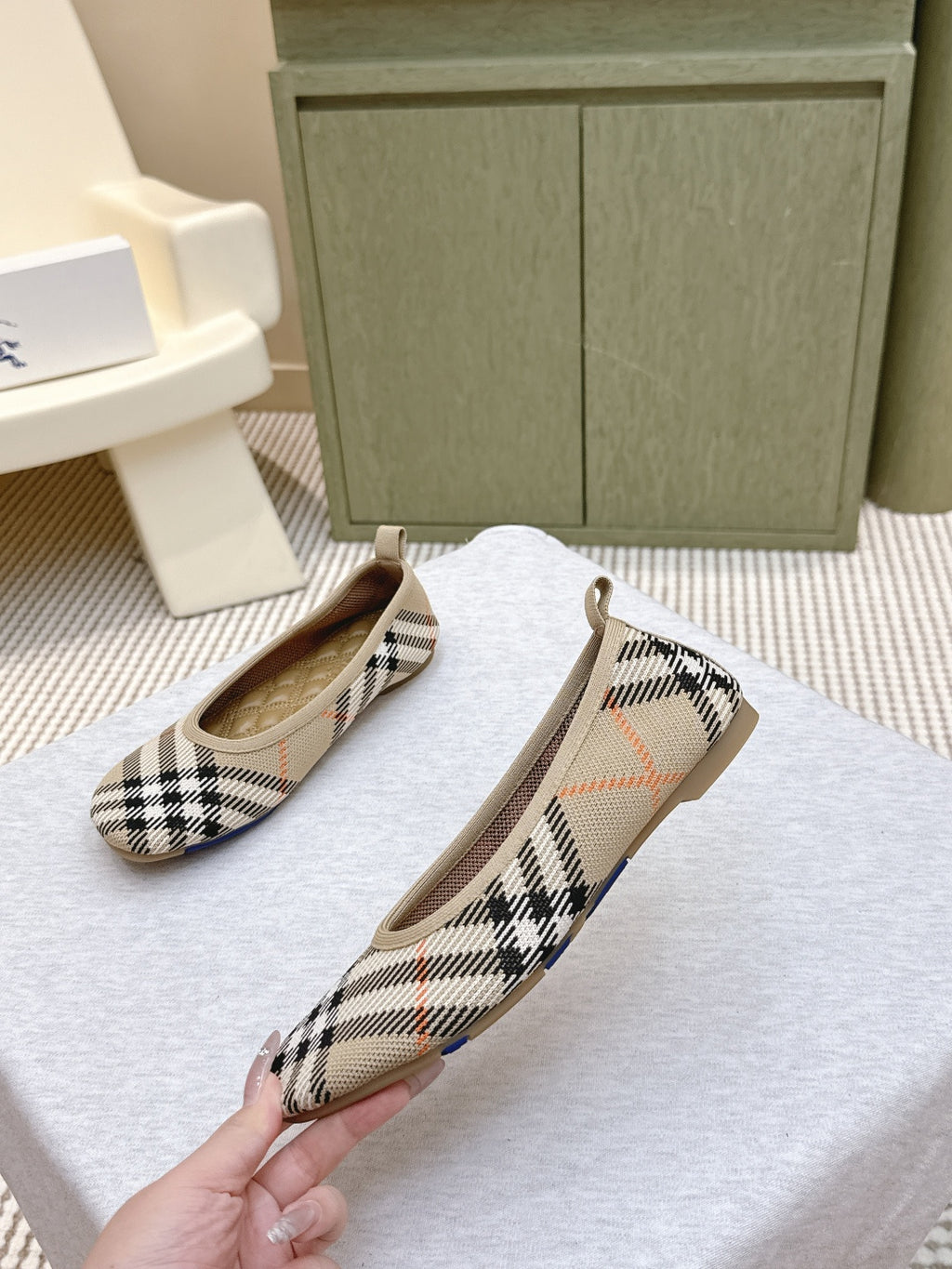 Plaid slip-on shoes angled view, tan insoles visible