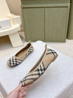 Plaid slip-on shoes angled view, tan insoles visible