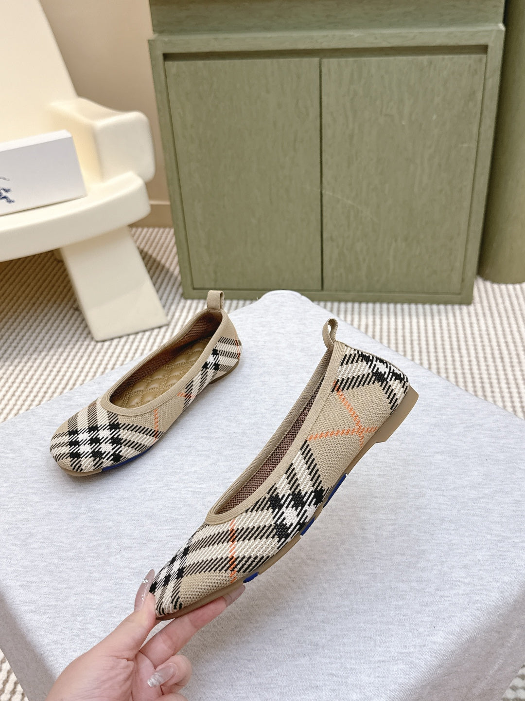Plaid slip-on shoes angled view, tan insoles visible