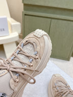 Moncler light beige sneaker toe and laces, studded strap detail on the side