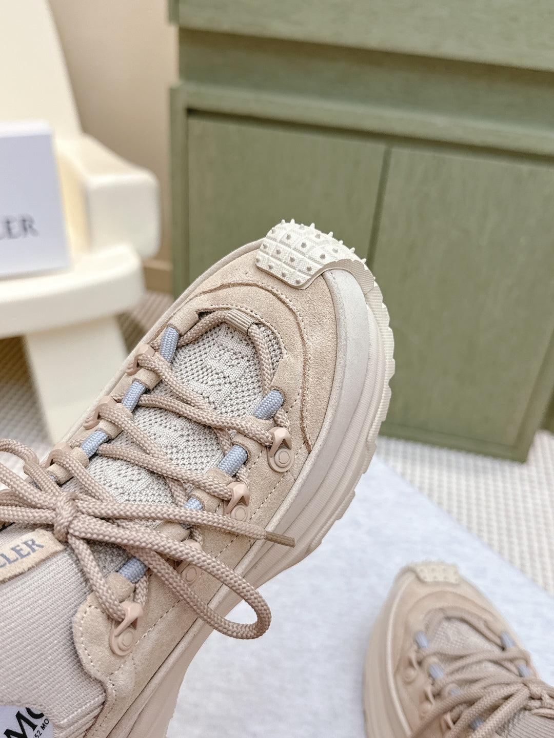 Moncler light beige sneaker toe and laces, studded strap detail on the side