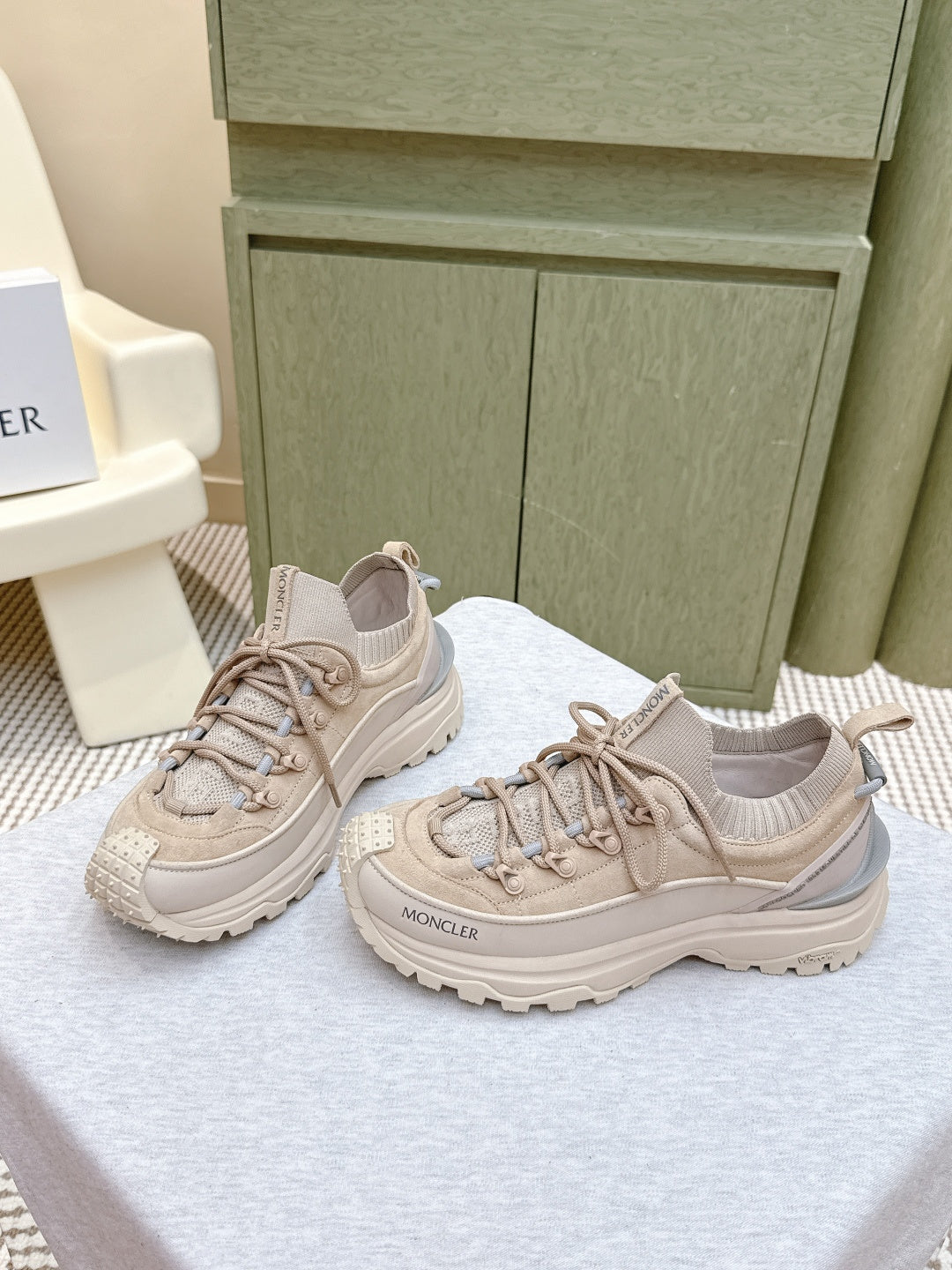 Moncler light beige sneakers, side view with textured upper and lace-up closure