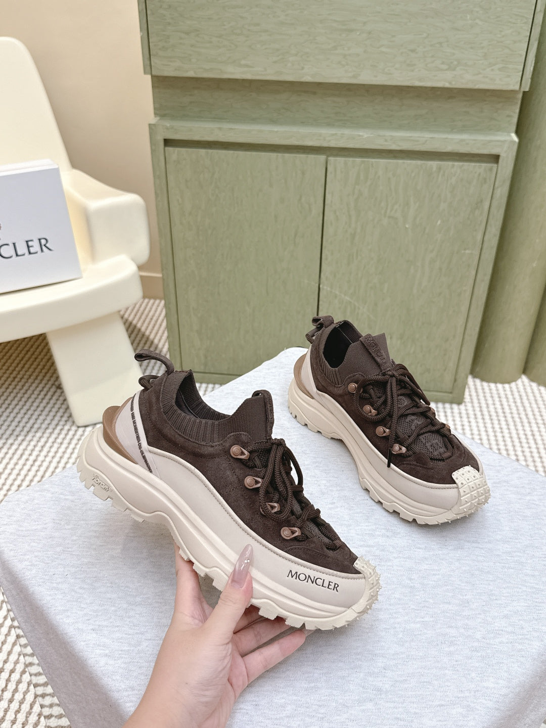 Dark brown sneakers with elastic collar, lace-up front, chunky white sole