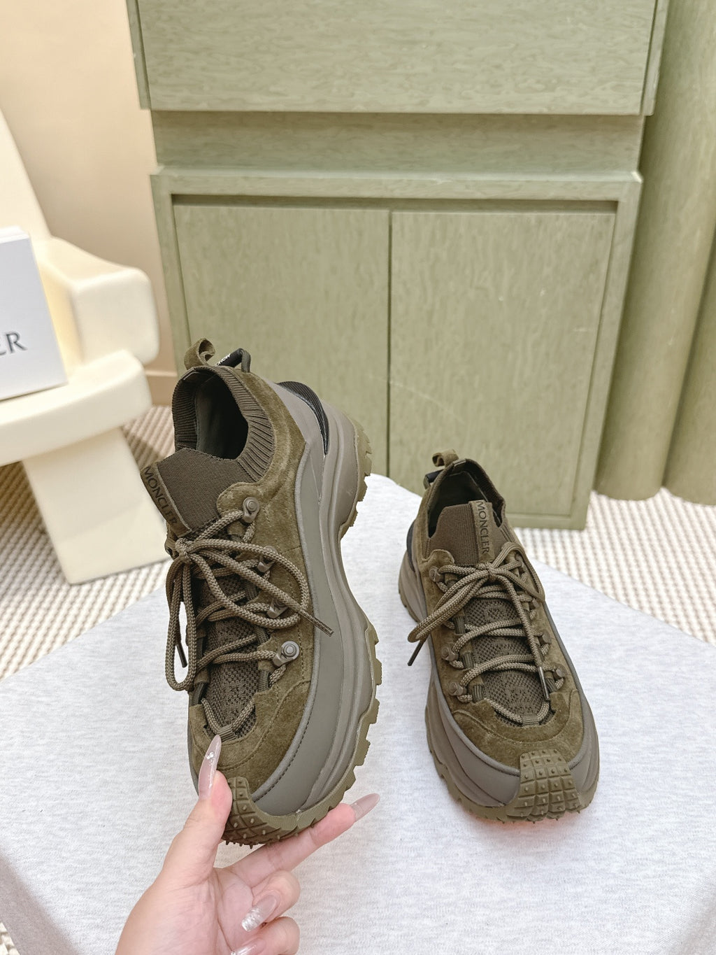 Moncler olive running sneaker with lace-up front and padded collar