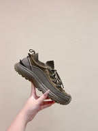Moncler olive running sneaker angled view with lace-up and side logo
