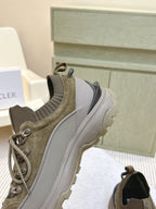 Moncler olive running sneaker side profile with lace-up and contrasting heel panel