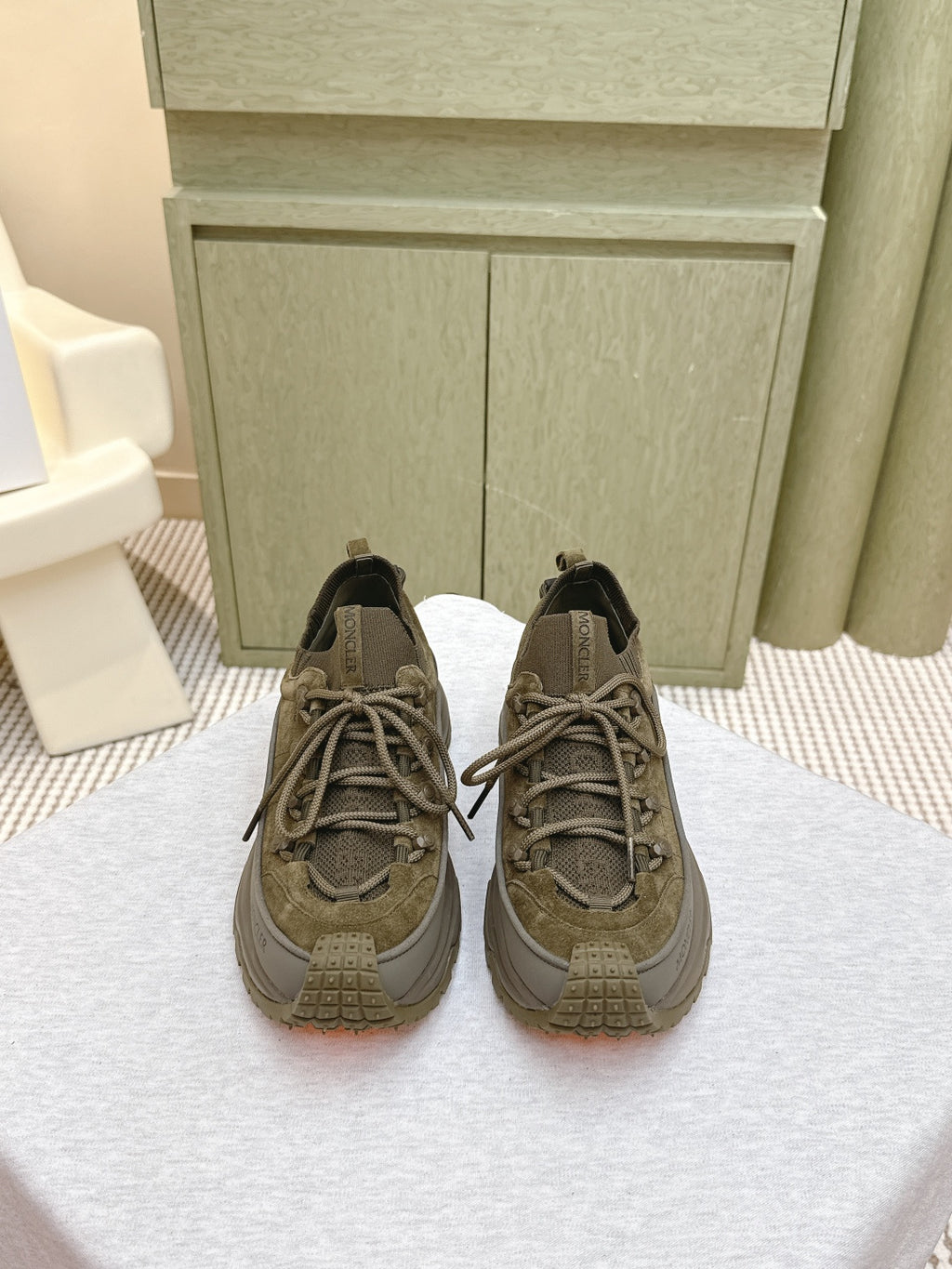 Moncler olive running sneaker with lace-up front and rubber lug sole
