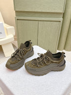 Moncler olive running sneakers showing lace-up and textured toe panel