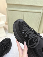 Black Moncler lace-up sneaker detail, textured panels and round eyelets