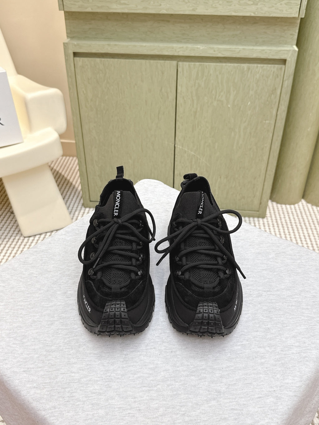 Black Moncler chunky lace-up sneaker, front view with treaded rubber sole