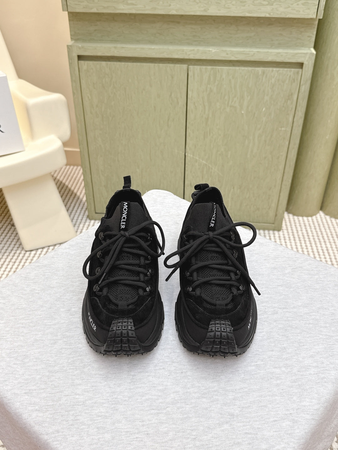 Black Moncler chunky lace-up sneaker, front view with treaded rubber sole