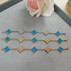 Clover charm bracelets with blue enamel and sparkling flower links in silver, gold, rose gold