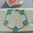 Van Cleef & Arpels clover charm bracelet, blue enamel on gold-tone chain