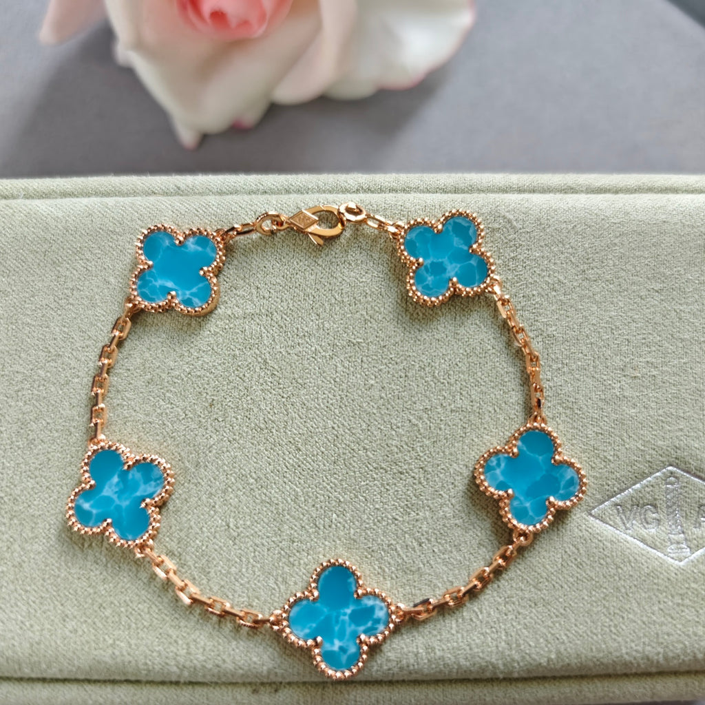 Van Cleef & Arpels clover charm bracelet, blue enamel on rose-gold tone chain
