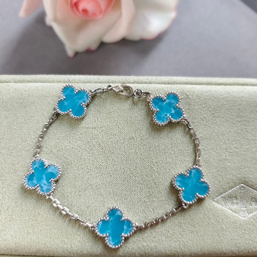 Van Cleef & Arpels clover charm bracelet, blue enamel clovers on silver-tone chain