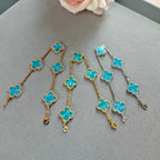 Van Cleef & Arpels clover charm bracelets, blue enamel on mixed gold and silver chains