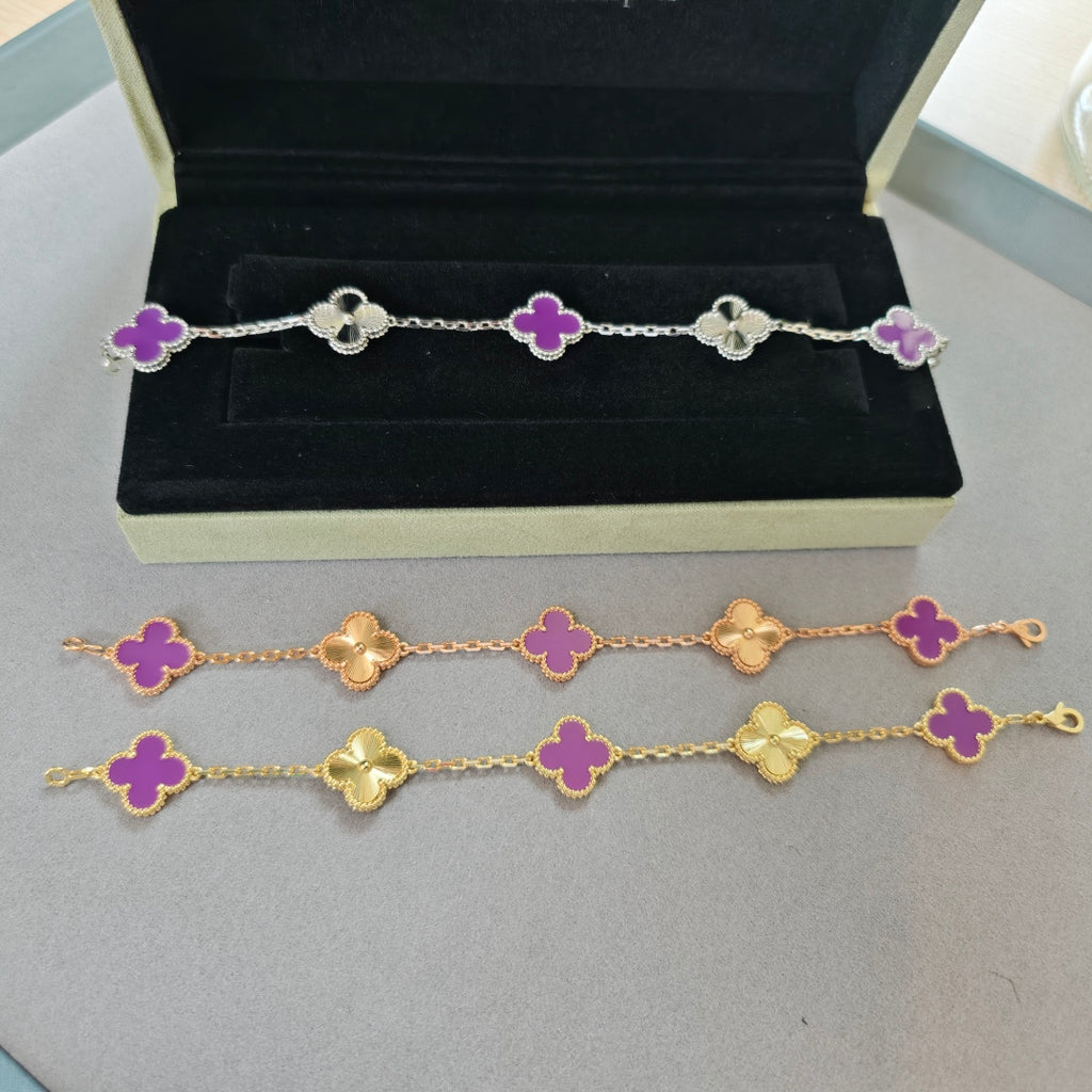Van Cleef & Arpels clover charm bracelet, silver with purple enamel clovers laid in box