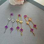 Van Cleef & Arpels clover charm bracelets, silver, gold, and rose gold with purple enamel clovers
