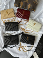 Assorted small YSL shoulder bags, tan, burgundy, black, pale yellow with chain straps