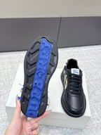 Burberry sneaker showing blue traction pattern underside with black outsole